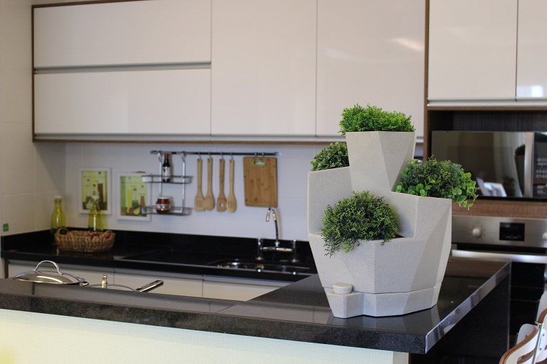 self watering planter located in the kitchen 