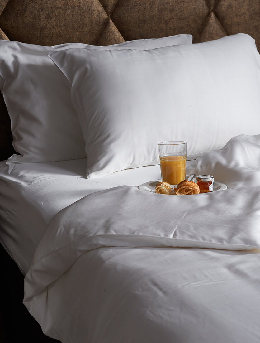 breakfast in bed on white bamboo sheets