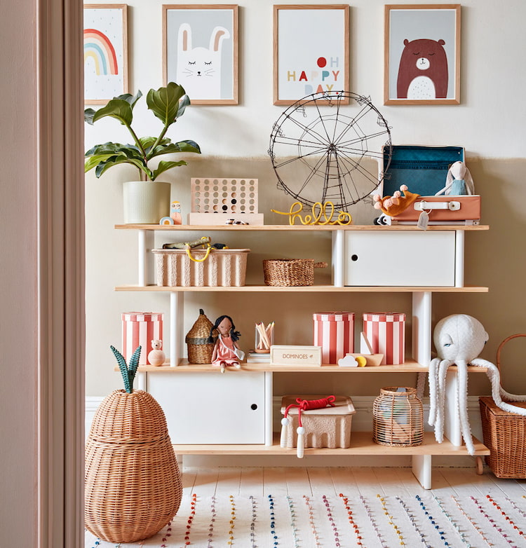 light wooden shelve decorated with kids toys