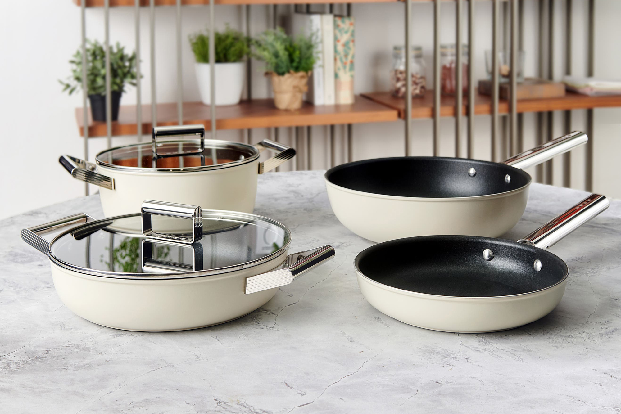 beige kitchen frying pans and pots