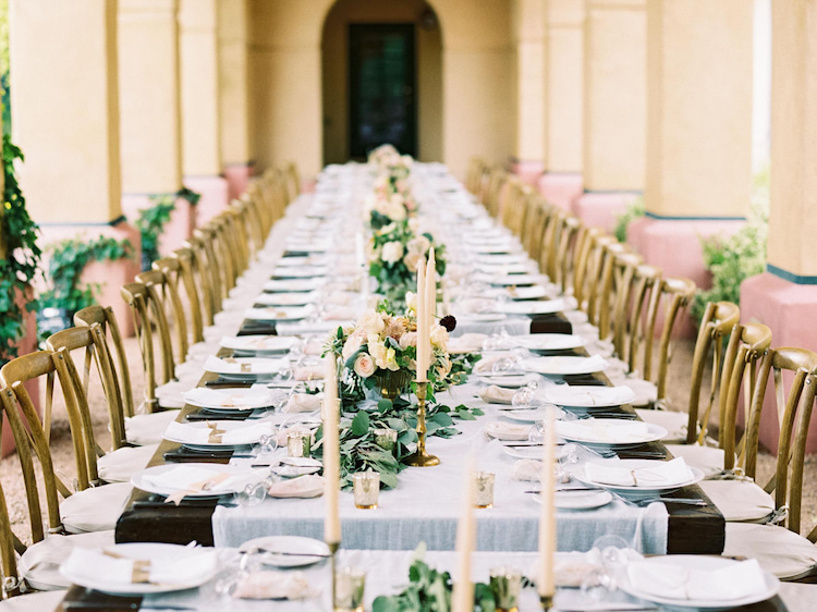 wedding linen tableclothes decorated with white flowers and candles