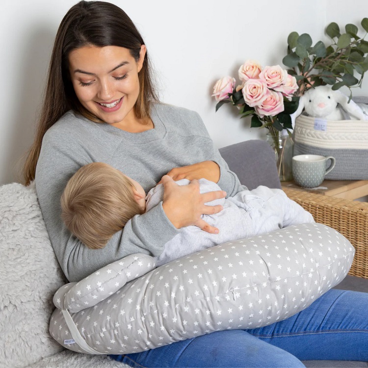 picture of a mother nursing an infant on a baby feeding pillow