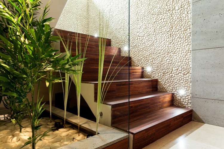 Illuminated wooden staircase in modern house, horizontal
