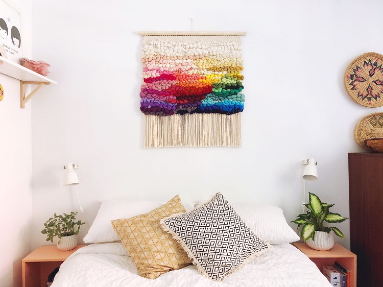 colorful textile wall hanging in the bedroom