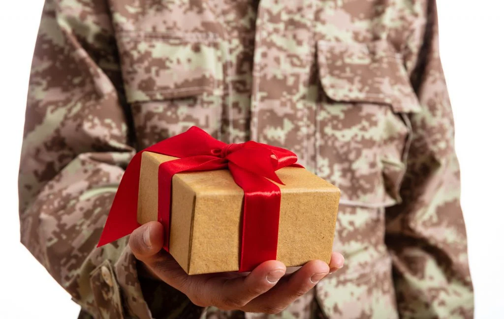 Soldier holding a gift 